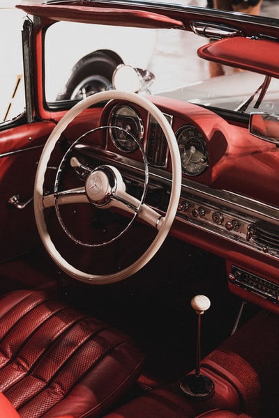 red and silver car steering wheel